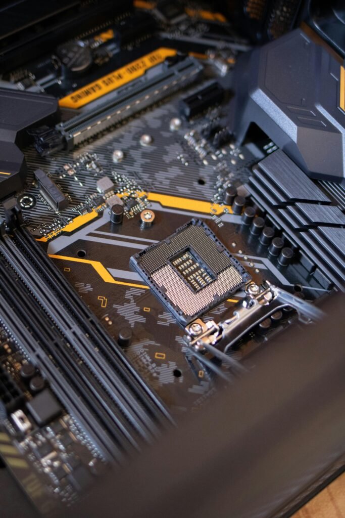 pexels-photo-2582937-2582937 Detailed view of a computer motherboard highlighting electronic components and technology connections.